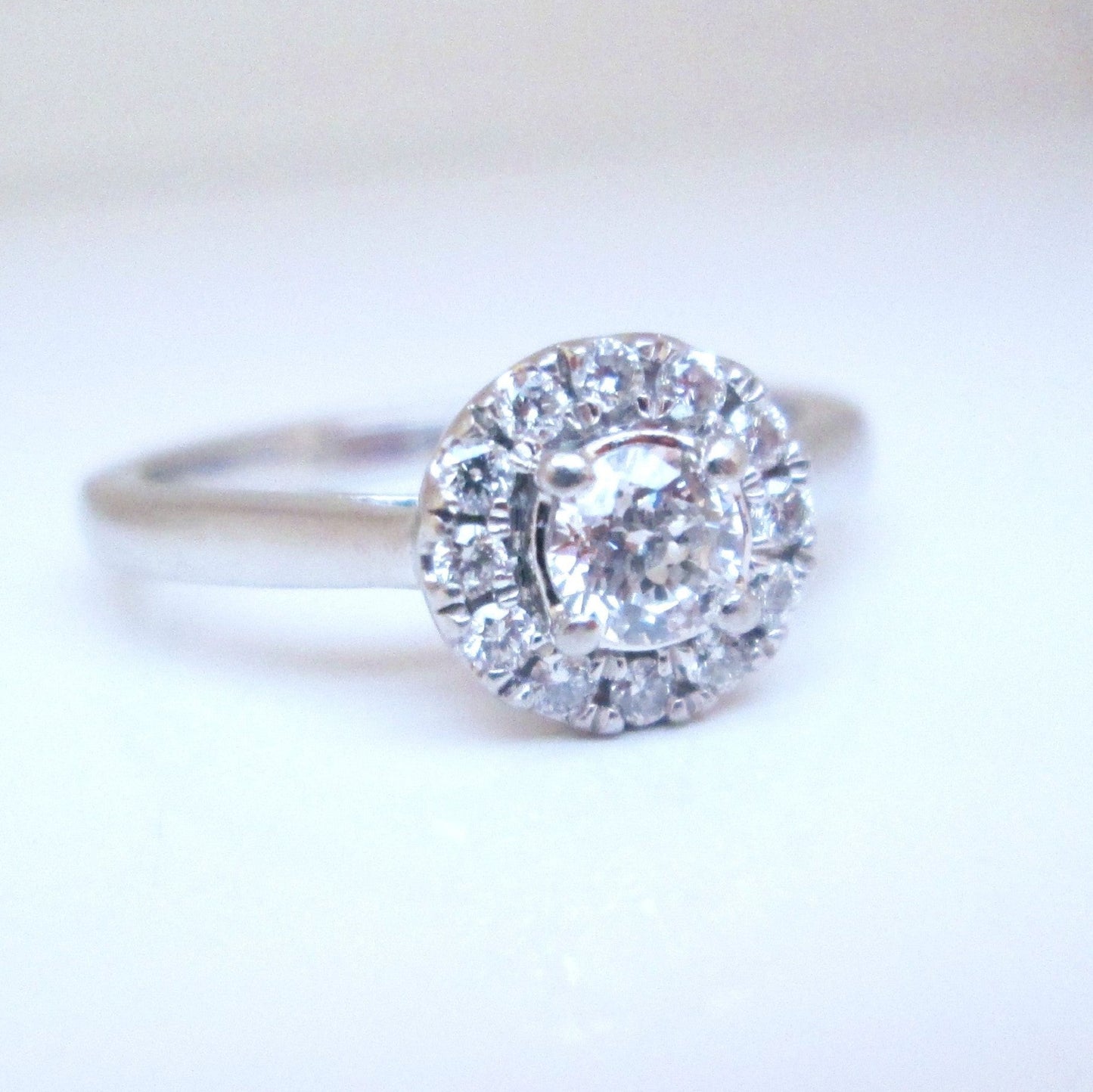 Platinum Round Brilliant Cut Forever Diamond Halo Cluster Ring