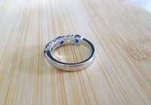 Load image into Gallery viewer, Platinum 1.25ct Brilliant Cut Diamond &amp; Sapphire Tension Set Eternity Ring
